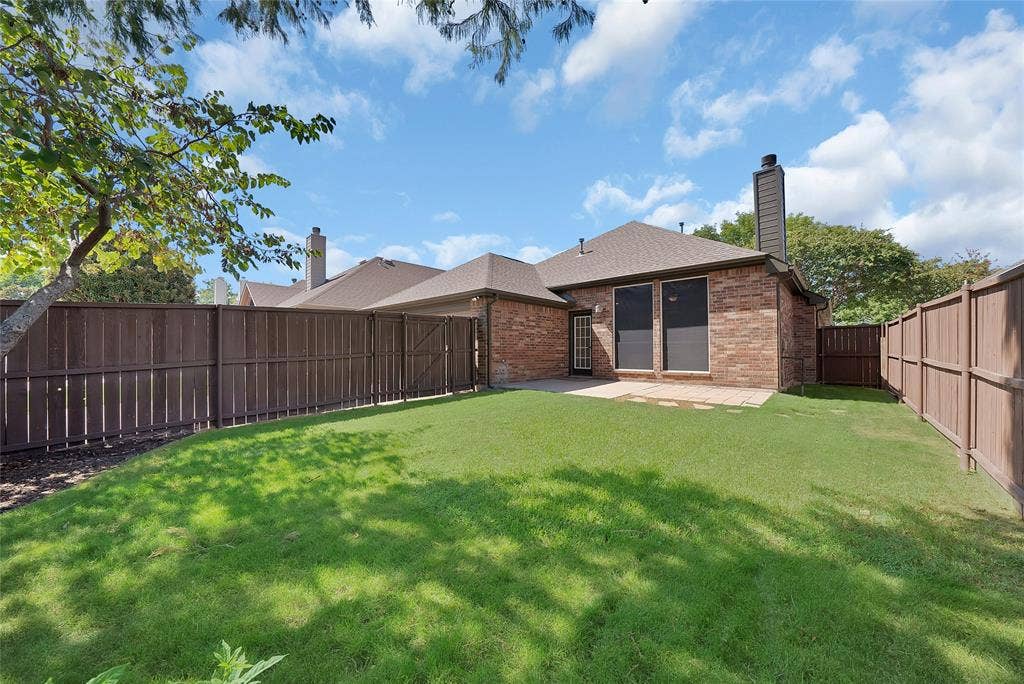1687 Garrison Drive, Frisco, TX 75033 Great backyard with mature shade trees and plenty of room for kids and pets. Fence has been restained.