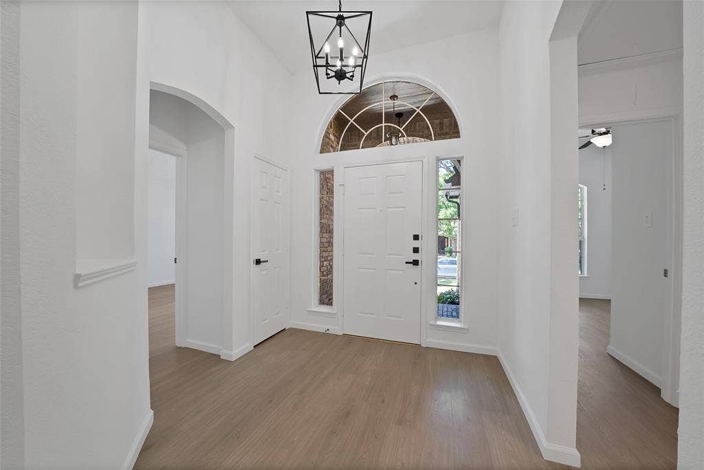 1687 Garrison Drive, Frisco, TX 75033 Beautiful light colored luxury laminate flooring welcomes you into the stunning home and extends throughout most of the home. No carpet!