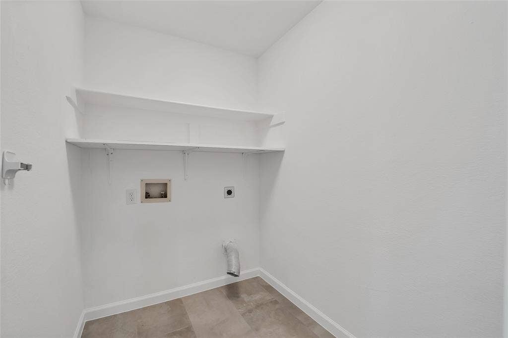 1687 Garrison Drive, Frisco, TX 75033 Utility room has convenient shelves for your detergent and additional storage.