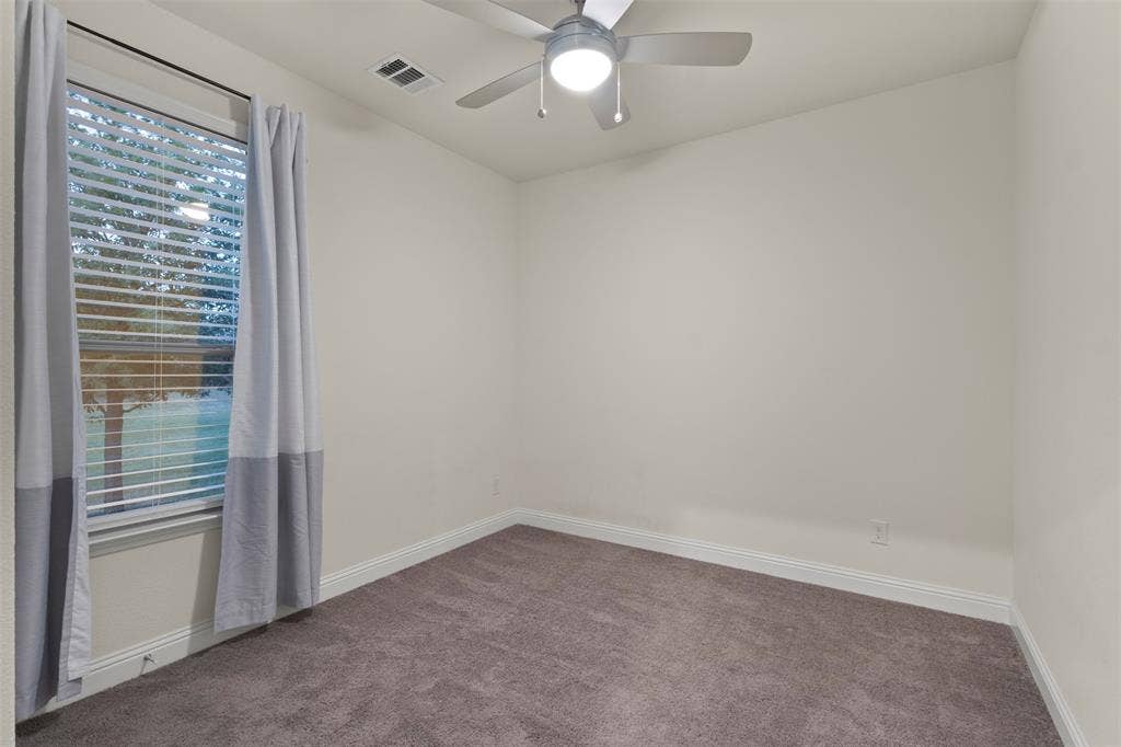8028 Hickory Branch Drive, Frisco, TX 75034 Window with blinds, wall-to-wall carpeting, ceiling fan with integrated lighting, and white baseboards
