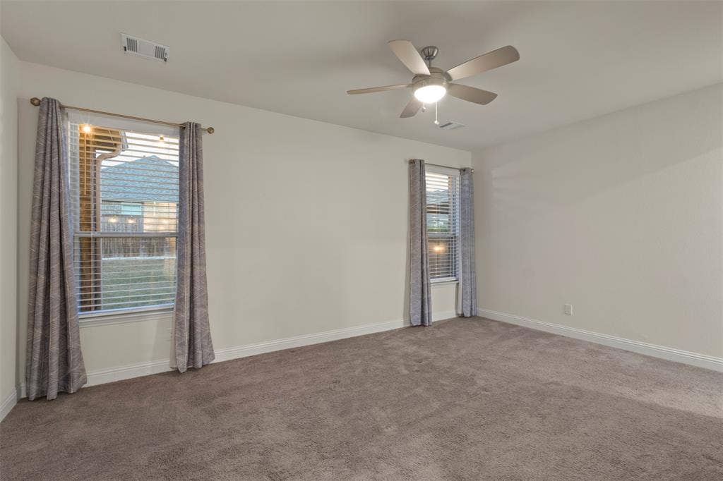 8028 Hickory Branch Drive, Frisco, TX 75034 Wall-to-wall carpeting and a ceiling fan with integrated lighting