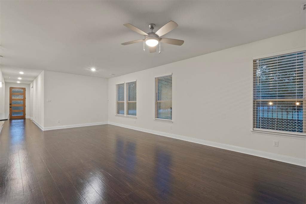 8028 Hickory Branch Drive, Frisco, TX 75034 Dark wood-finish flooring, recessed lighting, and a ceiling fan with integrated lighting