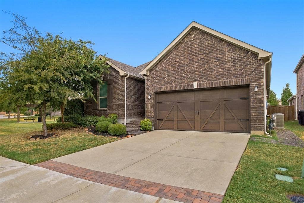 8028 Hickory Branch Drive, Frisco, TX 75034 Brick exterior with gabled roofline