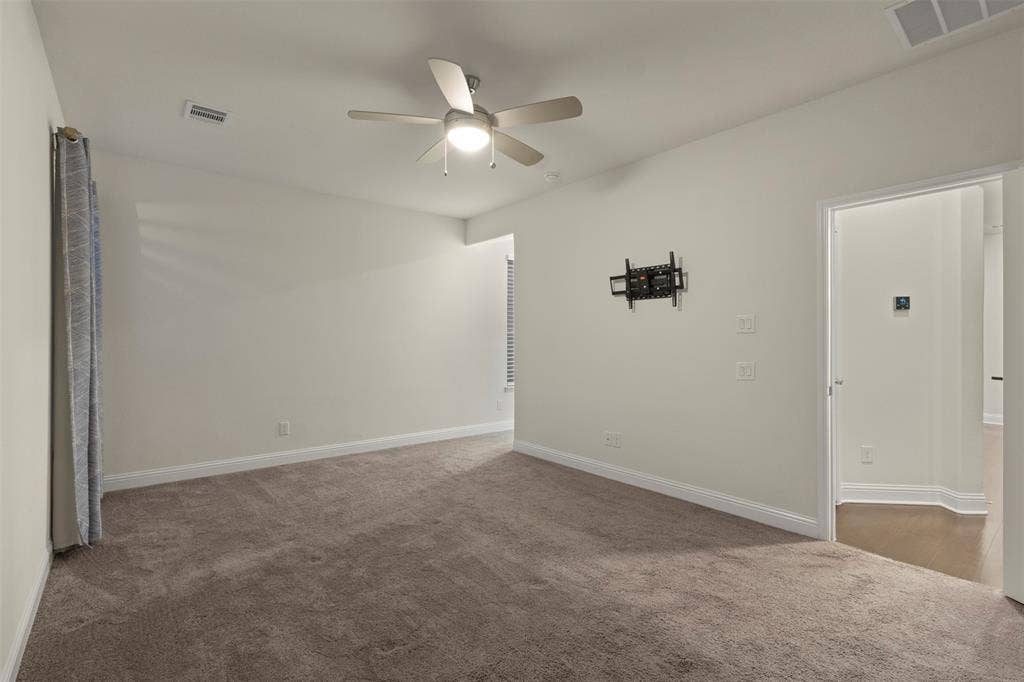 8028 Hickory Branch Drive, Frisco, TX 75034 Neutral wall tones, recessed lighting, and a ceiling fan with integrated lighting