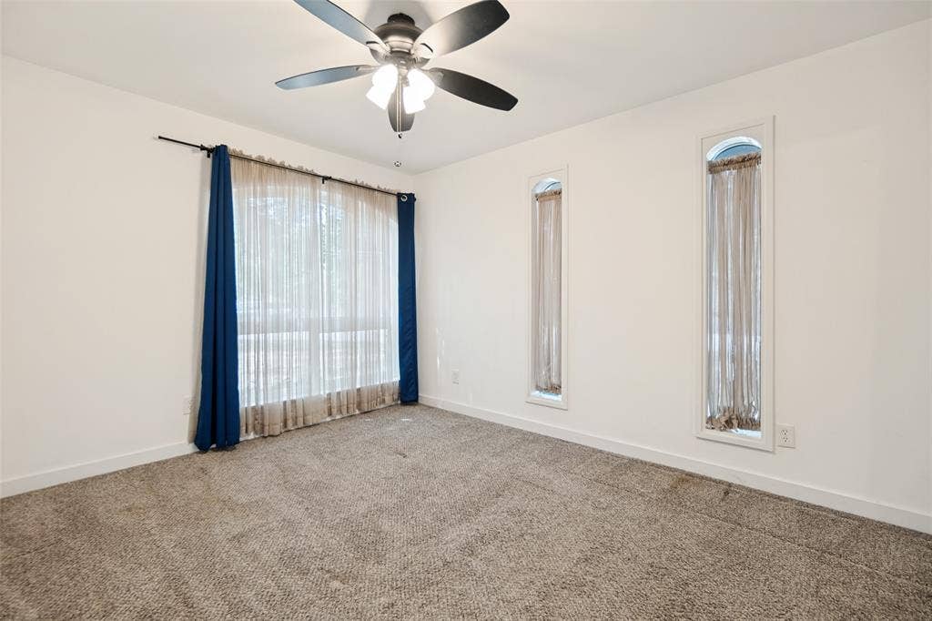 9038 Flicker Lane, Dallas, TX 75238 Recessed lighting, ceiling fan, and carpeted flooring