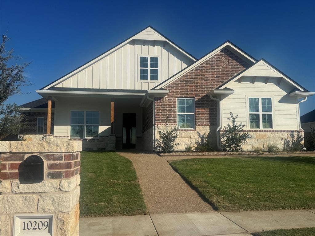 10209 Charmwood Drive, Waco, TX 76712 Brick and stone exterior with board and batten siding