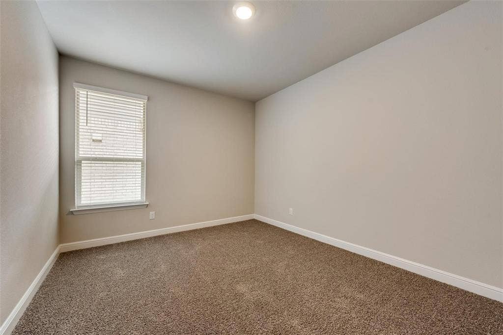 2441 Bellatrix Drive, Haslet, TX 76052 Empty room featuring carpet flooring