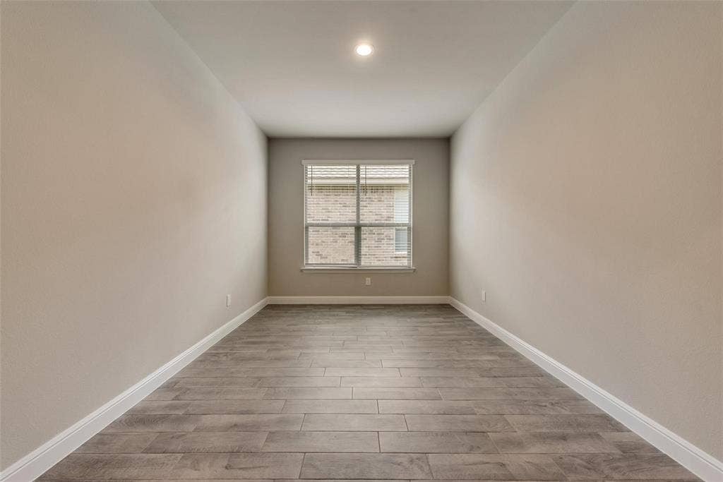 2441 Bellatrix Drive, Haslet, TX 76052 Spare room with hardwood / wood-style flooring