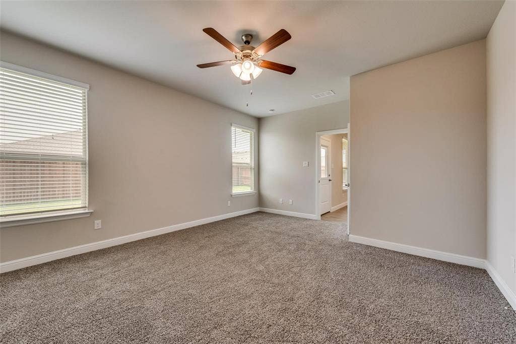 2441 Bellatrix Drive, Haslet, TX 76052 Empty room with carpet floors and ceiling fan
