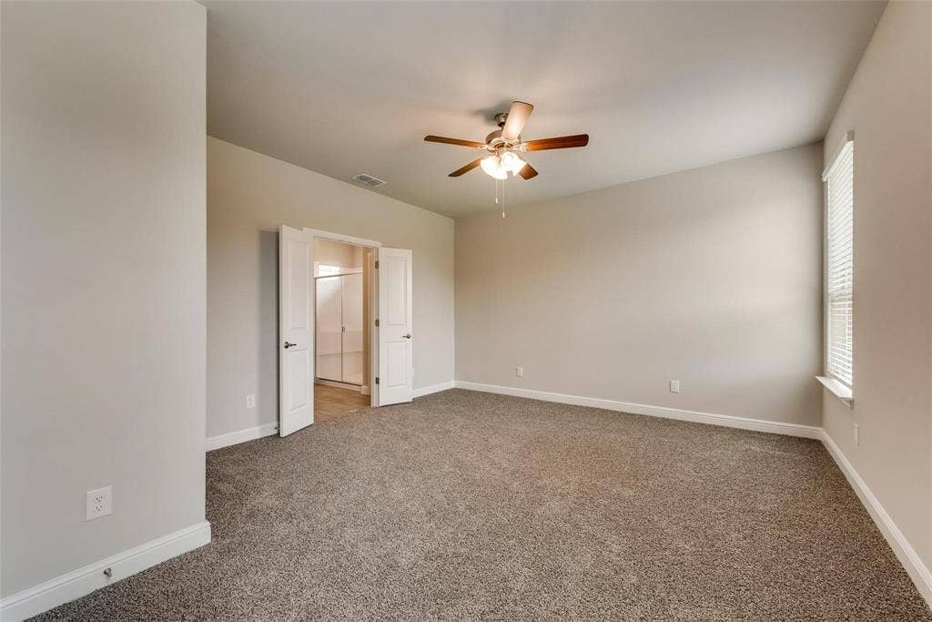 2441 Bellatrix Drive, Haslet, TX 76052 Empty room with carpet flooring and ceiling fan