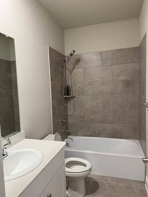 Modern bathroom featuring a white vanity with integrated sink, chrome faucet, and a large wall-mounted mirror