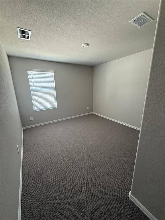 Wall-to-wall carpeting, window with blinds, recessed ceiling lighting, and light gray wall paint