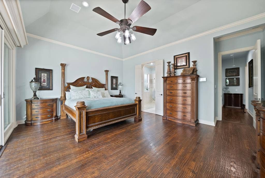 A truly impressive and private primary suite offers generous space, exceptional outdoor views, and a motorized blackout screen for peaceful mornings when you want to sleep in.