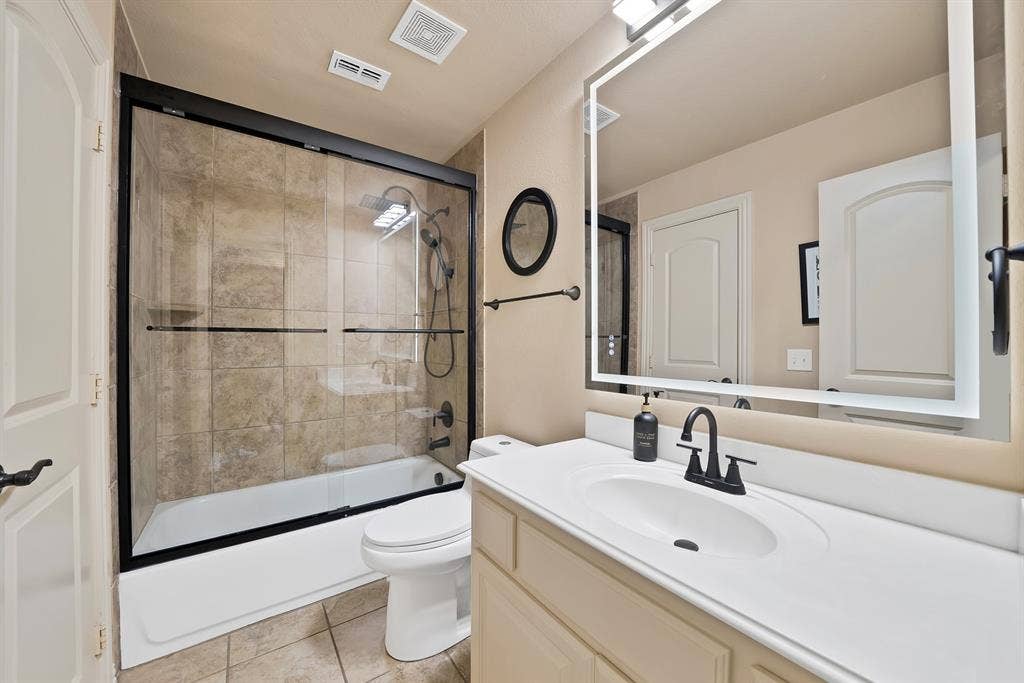 Upstairs Jack and Jill bathroom, beautifully updated space features modern finishes and thoughtful details that blend style, comfort, and functionality.