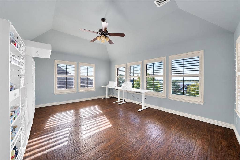 Game room that is currently used as a craft area, offers exceptional lake views. With its flexible design, the space can easily adapt to suit a variety of needs and lifestyles.