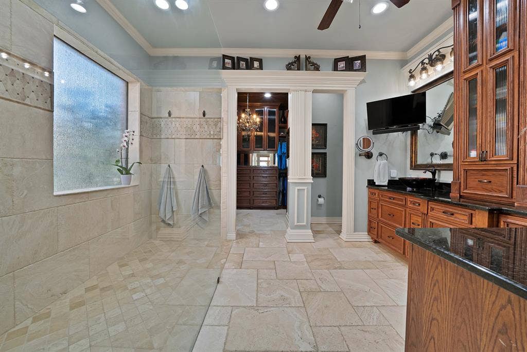 A beautifully updated primary bathroom delivers a true resort-inspired experience, featuring sophisticated finishes and generous space. Every detail creates a luxurious, spa-like retreat designed for comfort and relaxation.