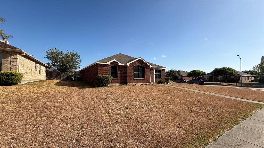 1815 Shanna Drive, Lancaster, TX 75134 Brick exterior with arched windows