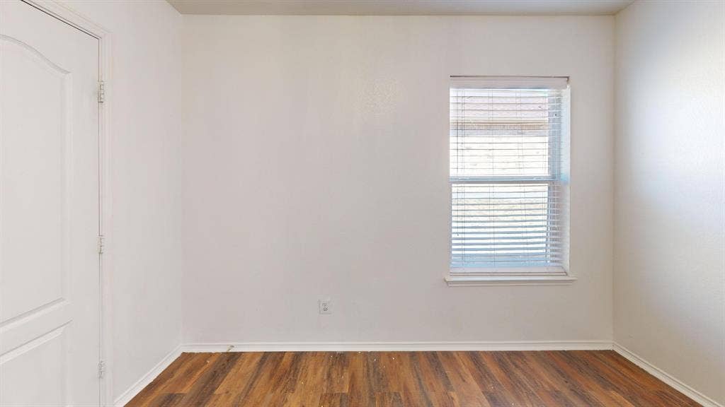 1815 Shanna Drive, Lancaster, TX 75134 Wood-finish flooring with white baseboards