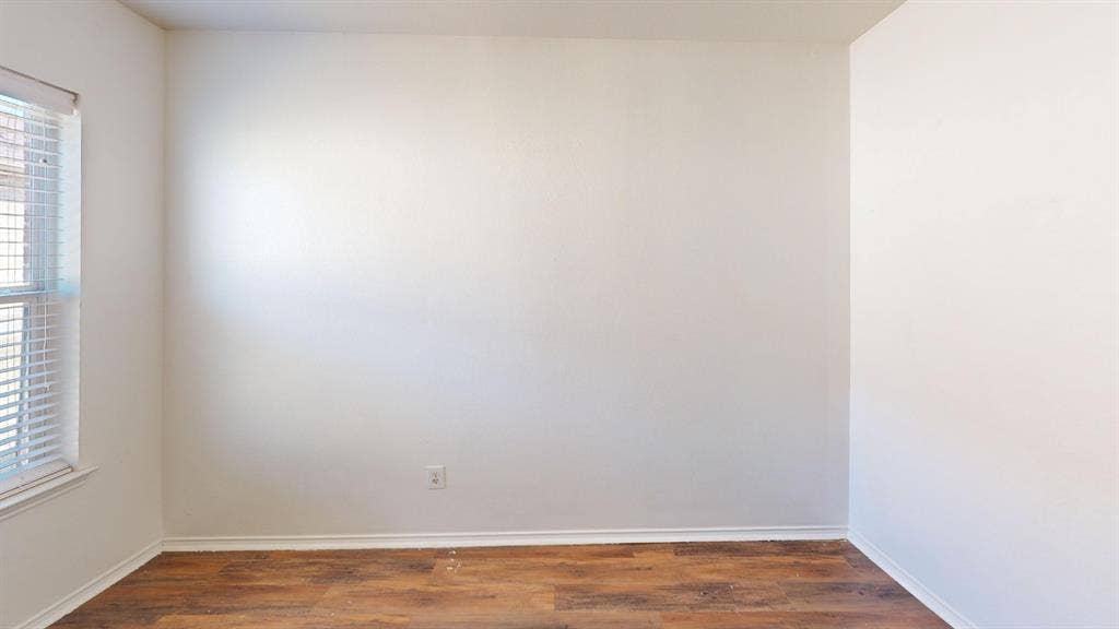 1815 Shanna Drive, Lancaster, TX 75134 Wood-finish flooring with crisp white trim