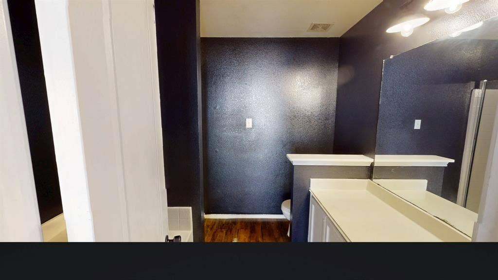 1815 Shanna Drive, Lancaster, TX 75134 White vanity with a neutral-toned countertop and an integrated sink
