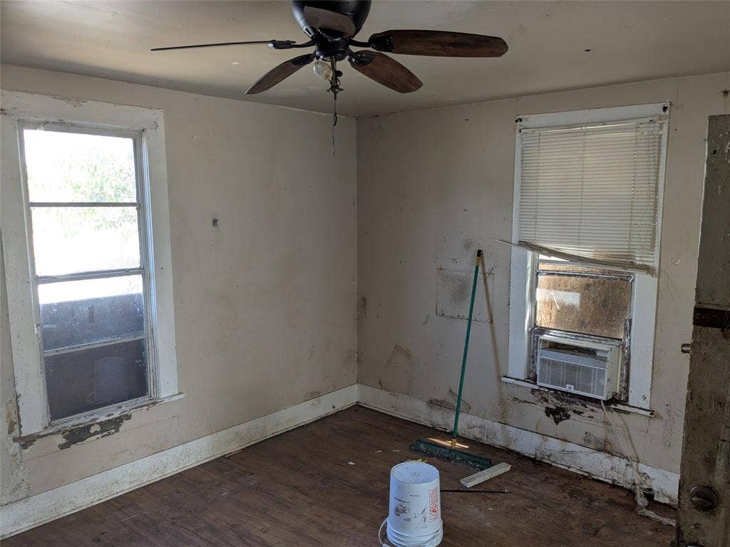 710 S 19th Street, Temple, TX 76504 Interior space featuring wood-finish flooring, a ceiling fan, and two windows