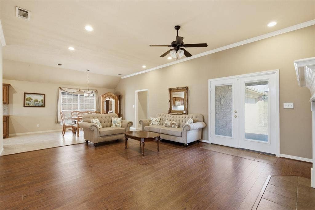 LIVING ROOM OVERLOOKS SPACIOUS DINING AREA