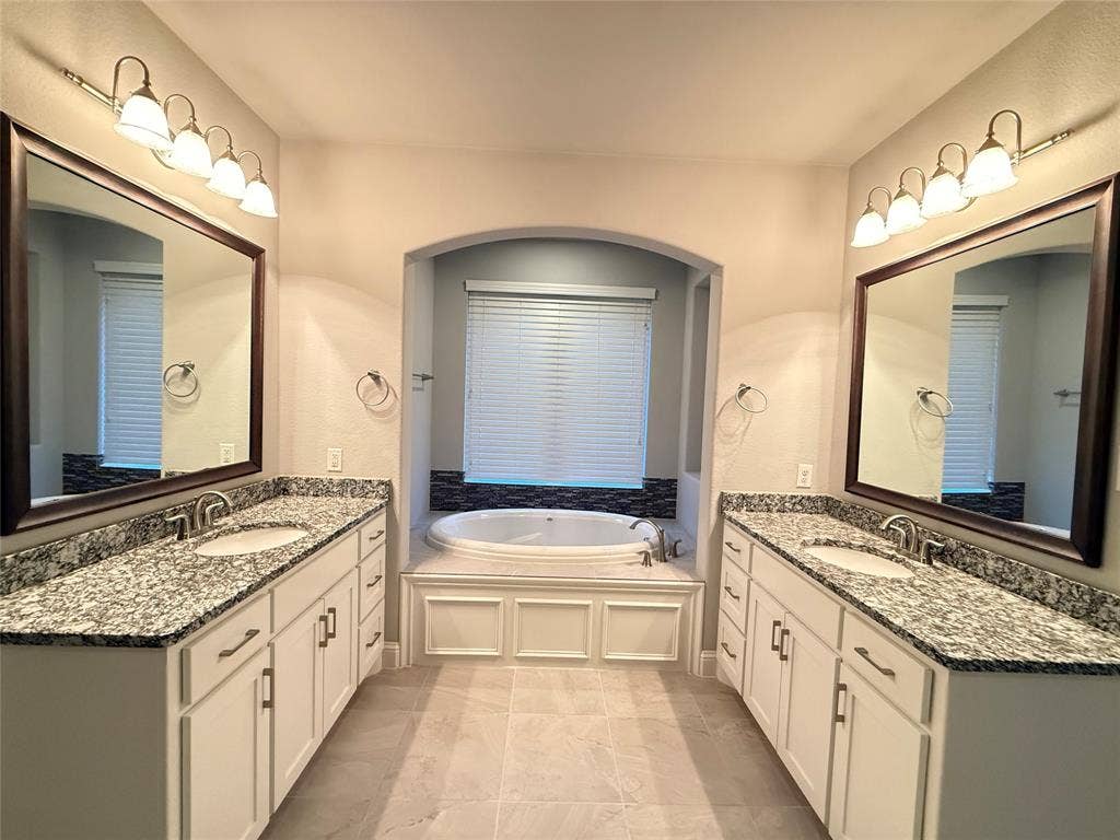 11818 Antler Drive, Frisco, TX 75035 Dual vanities with granite countertops, undermount sinks, and framed mirrors