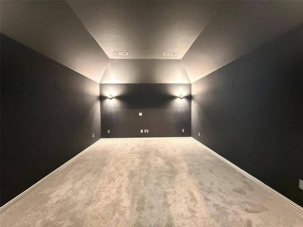 11818 Antler Drive, Frisco, TX 75035 Recessed ceiling, angled ceiling design, wall sconce lighting, dark wall finish, and neutral-toned carpeting