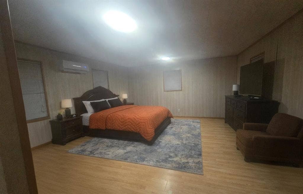 6220 W Highway 199, Springtown, TX 76082 Wood-finish flooring, recessed lighting, and a wall-mounted mini-split system