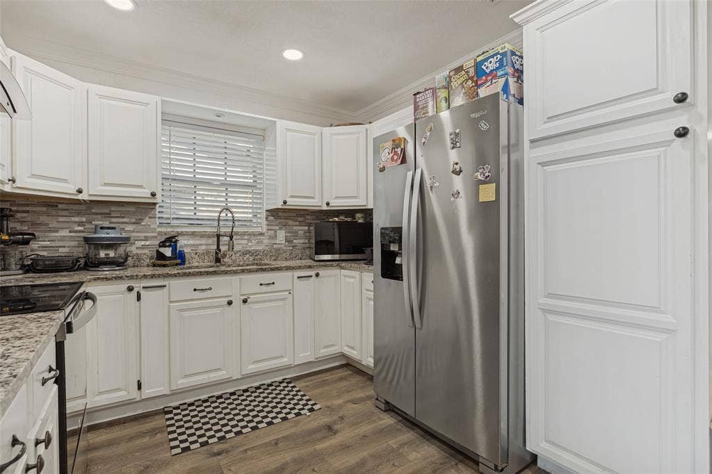 1522 Carroll Drive, Garland, TX 75041 Kitchen featuring white cabinetry, stone-surface countertops, stone tile backsplash, wood-finish flooring, and recessed lighting