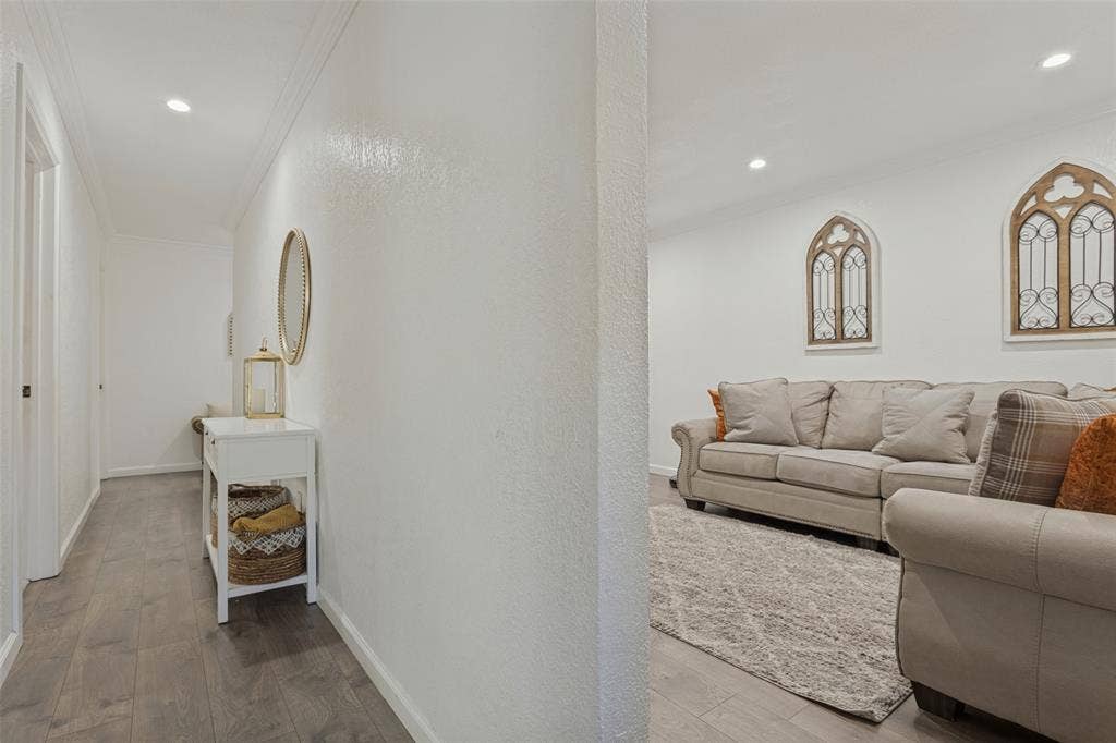 1522 Carroll Drive, Garland, TX 75041 Neutral interior space featuring wood-finish flooring, recessed lighting, and crown molding