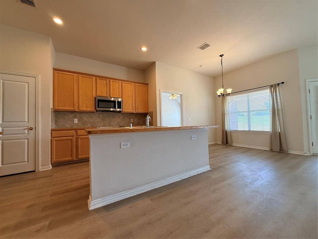 1308 Shinnecock, Fairview, TX 75069 kitchen is very open. SS appliances, 42 inch maple cabinets