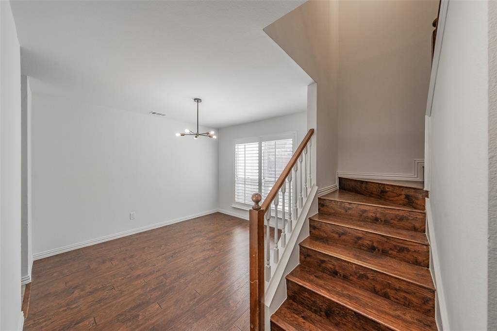 617 Dover Court, Coppell, TX 75019 Formal dining area and staircase leading to second floor