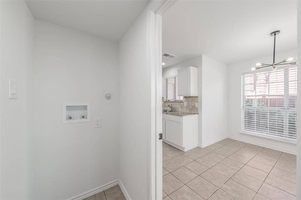 617 Dover Court, Coppell, TX 75019 full size washer and dryer hookups between kitchen and garage