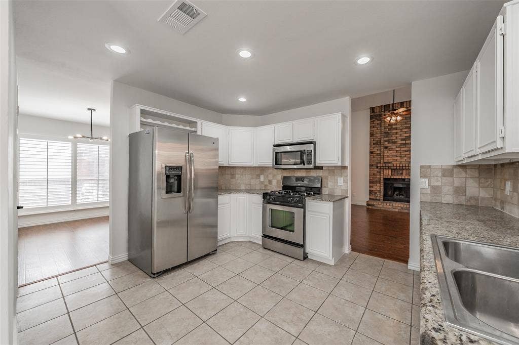 617 Dover Court, Coppell, TX 75019 Kitchen conveniently located near breakfast nook and utility leading to the garage
