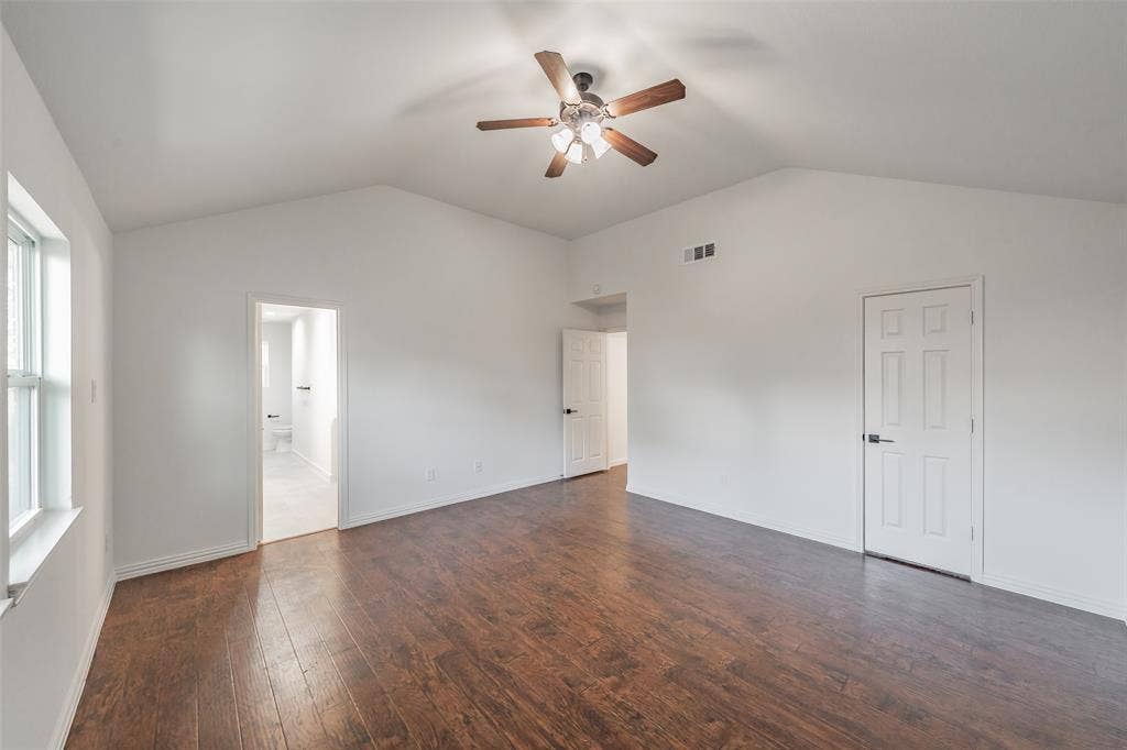 617 Dover Court, Coppell, TX 75019 Vaulted ceiling with a ceiling fan, wood-finish flooring, and white paneled doors