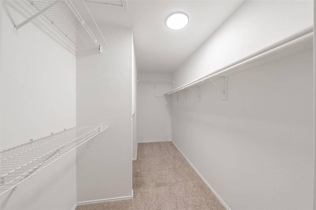 617 Dover Court, Coppell, TX 75019 Recessed ceiling light fixture, white wire shelving, white walls, and neutral carpet