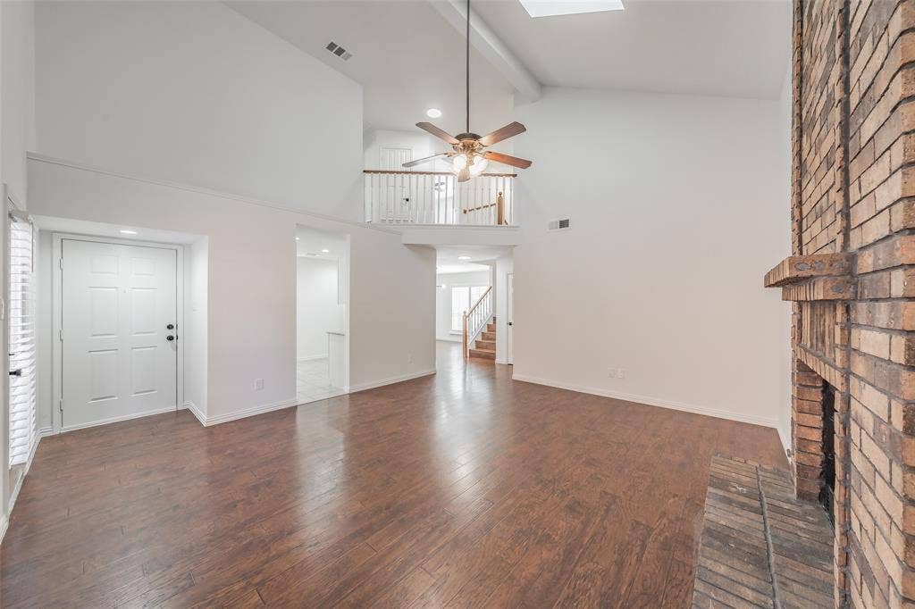 617 Dover Court, Coppell, TX 75019 Vaulted ceilings, wood flooring in the living room