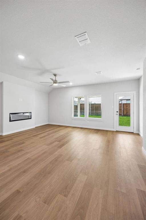 821 Talmadge Avenue, Aledo, TX 76008 Living Room in the Oscar home plan by Trophy Signature Homes – REPRESENTATIVE PHOTO