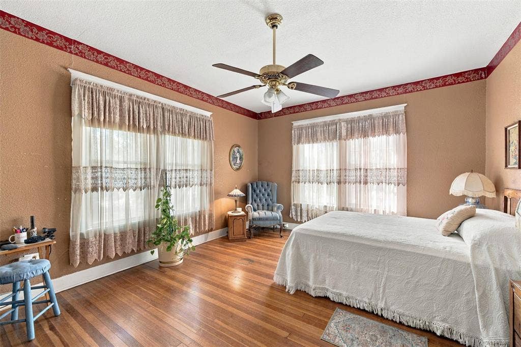 2725 Morrow Avenue, Waco, TX 76707 Hardwood flooring, two large windows, ceiling fan with integrated lighting, decorative wall trim