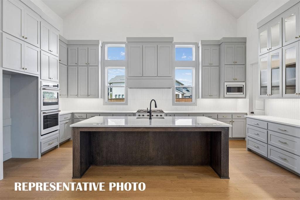 Featuring elegant finishes and space for everything, any chef would be proud to call this dream kitchen their own!  REPRESENTATIVE PHOTO