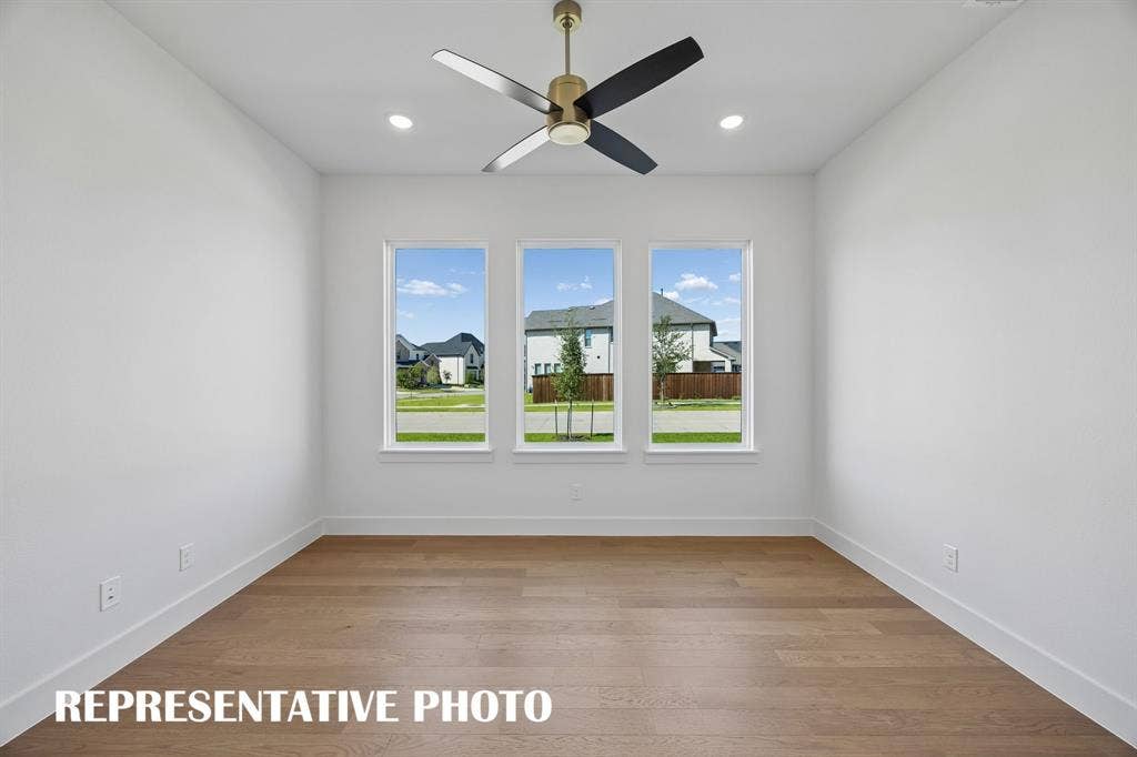 The professional working from home will appreciate this private, light filled home office.  REPRESENTATIVE PHOTO