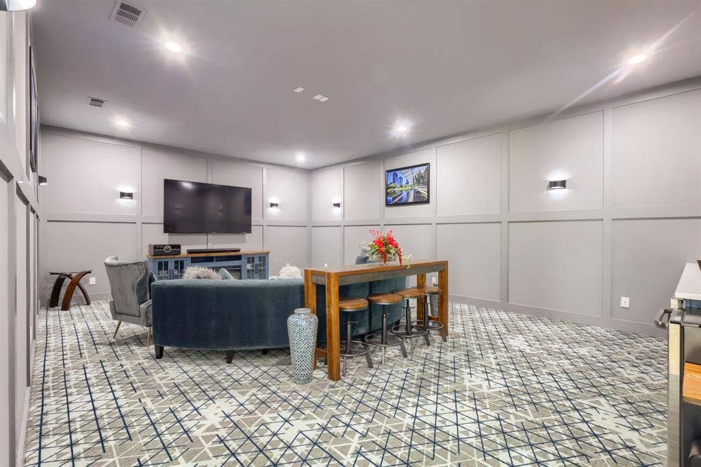 3950 Beechwood Lane, Dallas, TX 75220 Recessed ceiling lighting, wainscoting paneling, patterned wall-to-wall carpeting, and wall sconces