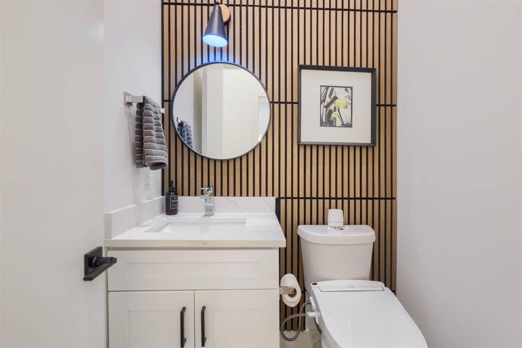 3950 Beechwood Lane, Dallas, TX 75220 White vanity with shaker-style cabinetry, a quartz countertop, and a rectangular undermount sink
