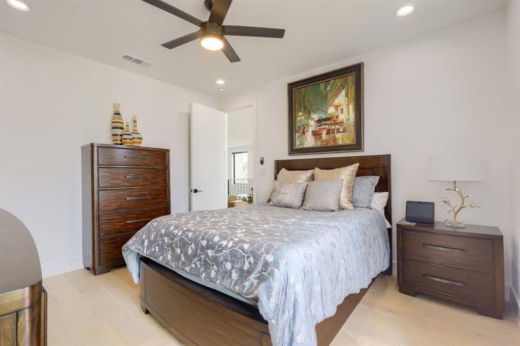 3950 Beechwood Lane, Dallas, TX 75220 Wood-finish flooring, recessed lighting, and a ceiling fan with integrated lighting