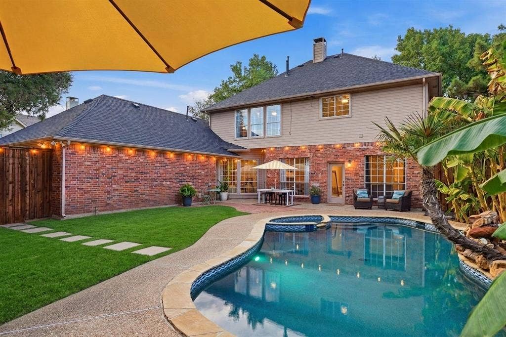 6416 Andora Drive, Plano, TX 75093 RARE additional yard space with heated pool/spa and waterfall. Rendered to show pool without removable child pool gate.