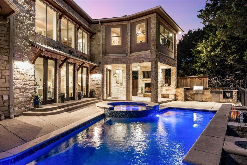 Covered outdoor living space with kitchen.