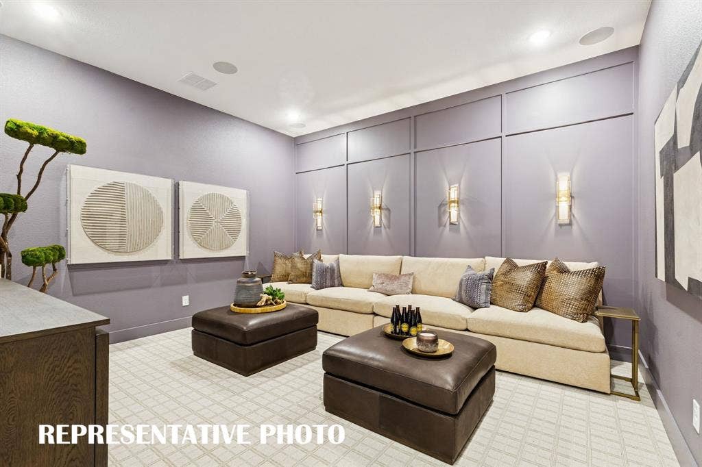 Whether you are hosting family movie night or big game day parties, this main floor media room is the place to be!  REPRESENTATIVE PHOTO