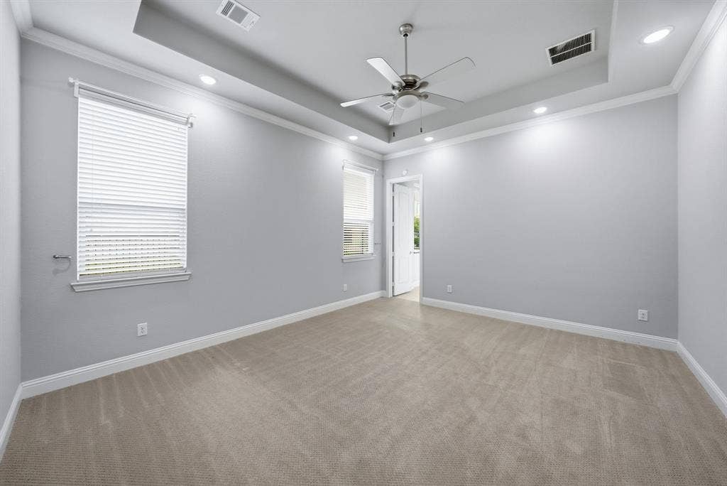 911 Midland Drive, Allen, TX 75013 Tray ceiling featuring a ceiling fan, recessed lighting, and crown molding