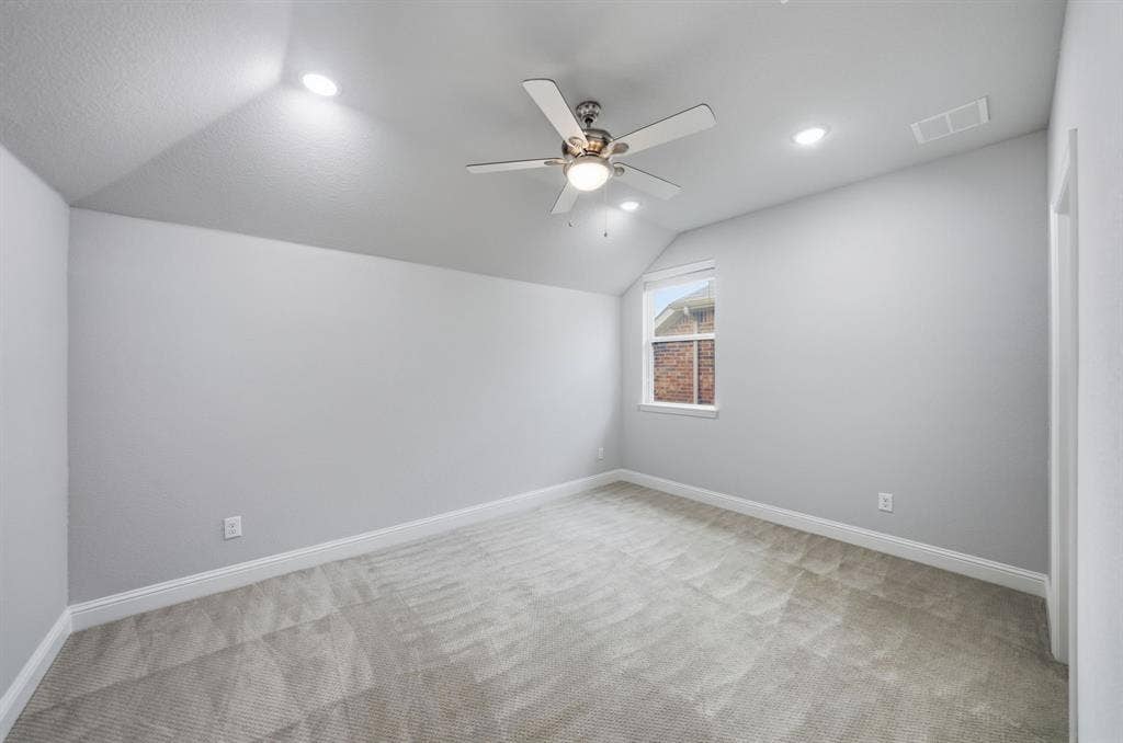 911 Midland Drive, Allen, TX 75013 Sloped ceiling with recessed lighting, ceiling fan, and carpet flooring
